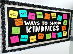 a bulletin board with post it notes on it and the words, ways to show kindness