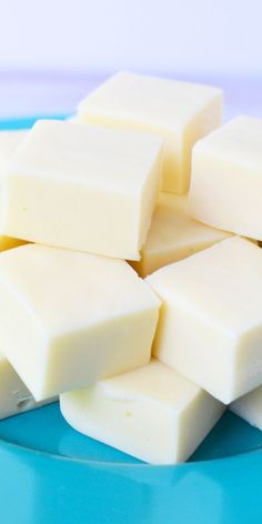 pieces of white chocolate sitting on top of a blue plate