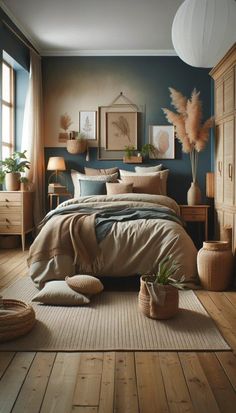 a bedroom with blue walls and wooden floors