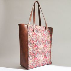 Scenes from a forest are interpreted in abstract forms on this classic tote. Crafted in Canvas and PU Leather, this bag is sturdy, spacious and ergonomically designed. Best paired with birdcall. Brown Abstract Forms, Heritage Crafts, Indian Heritage, 50th Gifts, Old Art, Unique Home Decor, Coaster Set, Contemporary Style, Pu Leather