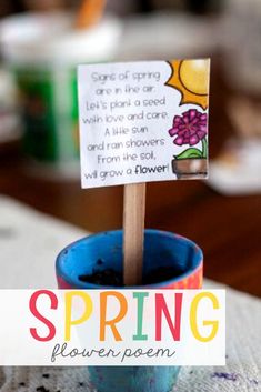 a small blue flower pot with a sign on it that says, spring flowering poem