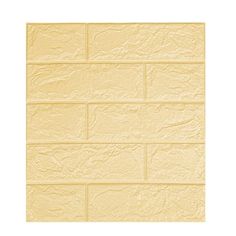 a yellow brick wall textured with white paint