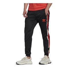 adidas Chile 20 Track Pants 'Black Red' H65540 (Men's/Stripe/Classic) Adidas Relaxed Fit Sports Pants, Sporty Adidas Jogging Bottoms, Sporty Adidas Bottoms With Logo, Sportswear Joggers With Three Stripes Branding, Sportswear Bottoms With Three Stripes Branding For Jogging, Spring Sportswear Bottoms With Side Stripes, Adidas Jogging Pants With Three Stripes, Adidas Sporty Joggers, Sporty Adidas Logo Pants For Sports