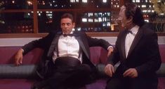 two men in tuxedos sitting on a couch with the caption, lots of expressions minor nutty full perpetation and lots of tuxedos