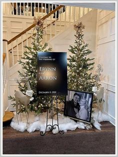 the christmas tree is next to a sign that says evelyn aaron