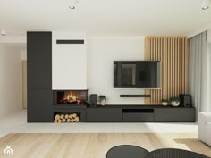 modern living room with fireplace and flat screen tv mounted on the wall in front of it