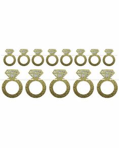 six pairs of gold glittered rings with diamonds on them