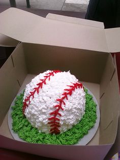 a baseball cake in a box on a table