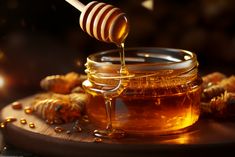 a jar of honey with a wooden spoon full of honey