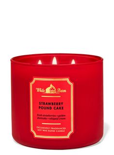 a red candle that is sitting in front of a white background with the words strawberry pound cake on it