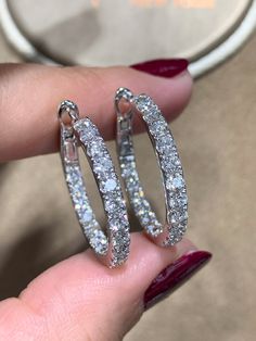 These diamond hoop earrings have been given a stylish touch with elegant round cut diamonds placed inside and out. 18Kt white gold hoop earrings are set with 2.48carats in round diamonds. Every woman can always use a pair of classic diamond hoop earrings to add to their wardrobe. Accessorize with these hoop earrings for fun and casual looks, or formal occasions where you want focus to be on your outfit.Metal: 18KT White GoldDiamond Weight: 2.48ct t.w.Diamond Shape: 38 RoundEarring Width: 3 mmEar Diamond Hoop Earrings Medium, Diamond Earrings Hoop, White Gold Hoop Earrings, Fake Diamond, White Gold Hoops, Party Outfits, Diamond Hoop Earrings, Dream Jewelry, Diamond Shape