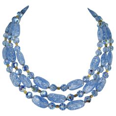 A stunning Trifari 3 strand bib Necklace with faceted Auroura Borilias Beads running in between the larger swirled glass beads. Length ranging from 14 inches to 16 inches on the BIB necklace Barrel beads .21.07 mm X 11.50 mm. 8.50mm smaller round bead running in between. This is out of a massive collection of Contemporary designer clothing as well as Hopi, Zuni, Navajo, Southwestern, sterling silver, costume jewelry and fine jewelry from one collector. Be sure to check our store front for more f Gold Bib Necklace, Coral Beads Necklace, Multi Strand Beaded Necklace, Paper Bead Jewelry, Pearl And Diamond Necklace, Vintage Trifari, Gold Bead Necklace, Cultured Pearl Necklace, Color Coral