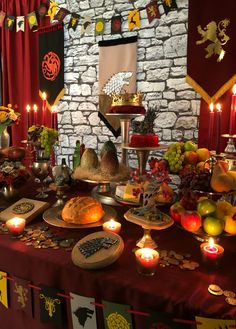 a table topped with lots of food and candles