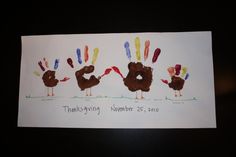 there is a card with three turkeys in the shape of handprints on it