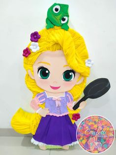 the doll is wearing a purple dress and holding a frying pan