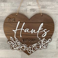 a wooden sign that says the hanks on it