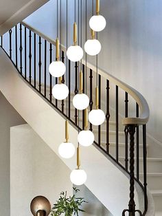 a stair case with several lights hanging from it