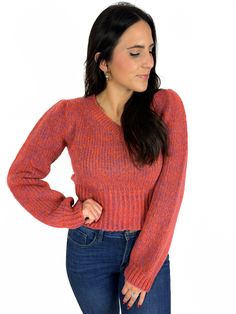 Heathered knits are all the rage this year. Here we have a super cute little sweater in an orange with purple tone heathered knit. This sweater is a shorter length with a V neck and puff sleeve. 50% polyamide 25% acrylic 25% polyester Model is wearing a small. Fire Sweater, Purple Tone, Puff Sleeve, This Year, Super Cute, V Neck, Orange, Knitting, Purple