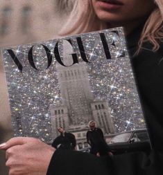 a woman holding up a book with the word yogurt on it in front of her face