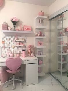 a white desk topped with a pink chair next to a walk in closet filled with lots of shelves