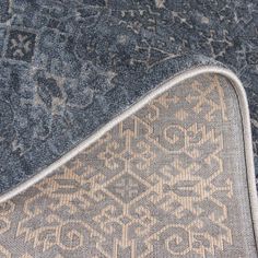 a blue rug with an intricate design on it