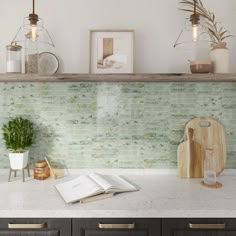 an open book sitting on top of a kitchen counter