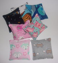 "Many uses for these little packs as the size is perfect for little hands besides a quick \"boo boo\" helper;  ~ Great hand warmers! Just slip a heated rice pad in a coat pocket for warmth on a cold winter day;  ~Toys - use as a bean bag.  Measures approximately 4\"x4\" and double stitched at filling end, plus topstitched around for stability. Materials: 100% cotton fleece fabric (same on both sides), filled with 1/2 cup of rice in each pack. HEATING INSTRUCTIONS depending on your microwave: Microwave for 20-40 seconds to achieve desired temperature. COOLING INSTRUCTIONS: Store in an airtight baggie  in the freezer for a cooling compress. CARE: Hand wash only - cannot be machine washed. Store in an airtight bag (baggie) when not in use. Will fill upon order to retain freshness. Each heatin Boo Boo Bags, Travel Sewing Kit, Rice Bag, Travel Sewing, Cup Of Rice, Rice Bags, Coat Pocket, Cotton Fleece, Bean Bag