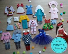 there are many different doll clothes and accessories on the table