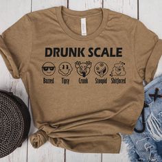 a t - shirt with the words drunk scale on it and three different emoticions