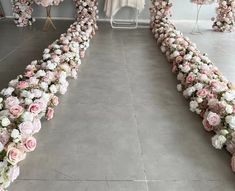 a room filled with lots of pink and white flowers