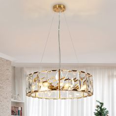 a chandelier hanging from the ceiling in a living room