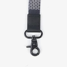 a black and white lanyard with a metal hook on it's clipping