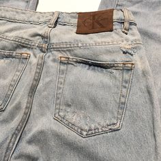 "Worn in vintage condition Distressed and faded in nicely Holes and discolorations around jeans(see photos) Ck Calvin Klein denim Size 24 on tag Please review measurements to ensure a proper fit and do not rely on the tag for sizing Waist:13.5\" Rise:10\" Inseam:26\" Hips:16\" Thigh:8\"" Faded Washed Cutoff Jeans, Classic Distressed Denim Jeans, Acid Wash Distressed Cutoff Jeans, Acid Wash Denim Cutoff Jeans, Classic Distressed Faded Jeans, Fitted Cutoff Faded Jeans, Fitted Faded Cutoff Jeans, Classic Faded Distressed Jeans, Acid Wash Distressed Mid-rise Jeans