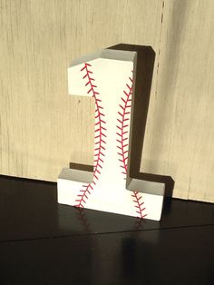 a paper mache shaped like a baseball with the number 1 on it's side