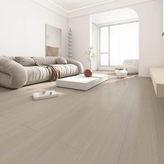 a modern living room with white walls and wood flooring is pictured in this image