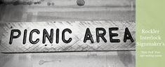 a close up of a street sign with the words picnic area on it and an arrow pointing to the right