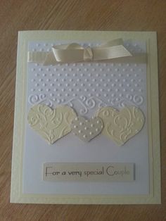 a card with two hearts on it that says for a very special couple