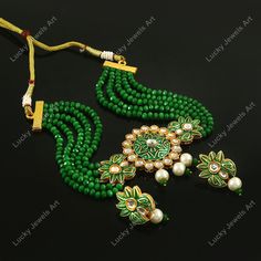 This is a stunning handmade choker necklace perfect for high end Jewelry Collector, a keeper in Traditional Vintage Indian/Pakistani Bridal jewelry and a Luxury Gift for your Daughter, Sister or Wife on Wedding or Anniversary. Perfect for any type of occasions, weddings And celebrations and a beautiful & memorable gift for weddings and special occasions. Description  Item Code:- L Gold Plated Fine Kundan & Green Beaded Choker Necklace Necklace Measures- Adjustable with a Dori/Cord Earring Measures- 35x20mm approx Quantity- One Necklace Set Please see more different designs here:- https://www.etsy.com/in-en/shop/LUCKYJEWELSART?ref=seller-platform-mcnav I make every item of my collection with a lot of love and care, I pay attention to every detail.  You are more than welcome to contact me fo Luxury Green Pearl Necklace As Gift, Luxury Handmade Choker For Celebration, Luxury Green Beaded Bridal Necklace, Luxury Kundan Pearl Earrings Gift, Luxury Kundan Necklace As Fine Jewelry Gift, Luxury Traditional Green Pearl Necklace, Luxury Green Kundan Necklace For Anniversary, Luxury Green Kundan Choker Necklace, Traditional Green Kundan Necklace, Luxury