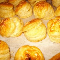 there are many different types of pastries on the tray