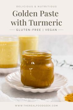 a jar of golden paste with turment next to it on a white plate