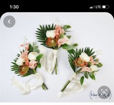 three bouquets of flowers and greenery on a white background