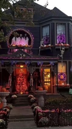 a house decorated with halloween decorations and lights