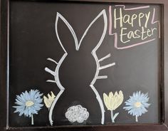 a chalkboard with an easter bunny drawn on it