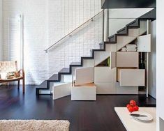 an advertisement for stairs in a house with white walls and wood floors, along with a staircase that leads up to the second floor