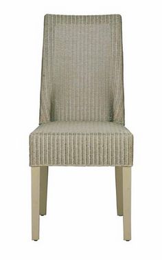 an upholstered chair with wooden legs and a striped seat cover on the back