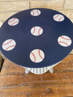 a table with baseballs painted on it