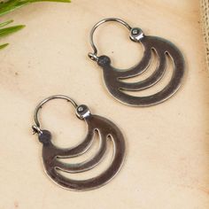 Evoking the shadows of crescents elegant openwork details these hoop earrings from Mexico. Martha Vargas creates these earrings crafted from sterling silver with a combination of finishes. Crescent Oxidized Sterling Silver Earrings, Adjustable Crescent Sterling Silver Hoop Earrings, Silver Crescent Hoop Earrings With Ear Wire, Bohemian Crescent Sterling Silver Hoop Earrings, Bohemian Crescent Hoop Earrings In Sterling Silver, Bohemian Sterling Silver Crescent Hoop Earrings, Sterling Silver Crescent Hoop Earrings, Metal Crescent Hoop Earrings, Adjustable Crescent Hoop Earrings