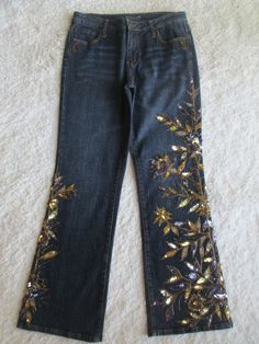 GITANO DENIM BLUE FLORAL EMBELLISHED JEANS * Brand - Gitano * Size - 14 * Waist - 32" - 34" * Hips - 40" * Rise - 10" * Inseam - 31 1/2" * Material - 56% Ramie 43% Cotton 1% Spandex * Color - Dark denim blue & Multi-color * Hand wash cold inside out only * Made in China Embellished Fitted Dark Wash Jeans, Embellished Denim Blue Straight Leg Jeans, Embellished Straight Leg Denim Blue Jeans, Fall Party Denim Blue Jeans, Straight Leg Sequin Denim Jeans, Straight Leg Denim Jeans With Sequins, Spring Straight Leg Sequined Jeans, Sequined Straight Leg Denim Jeans, Spring Sequined Straight Leg Jeans