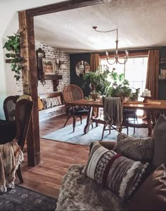 a living room filled with furniture and a wooden table