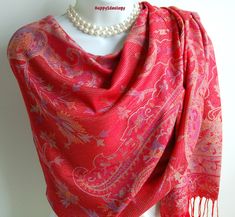 With a pretty scarf you can look gorgeous for very little money and is the most versatile accessory you could have in your closet. Our scarves are chic and affordable and they add a fun and happy punch to any outfit. Beautiful and elegant  Pashmina Scarf. Red color with floral paisley pattern design and tassels. Large, lightweight and soft  high quality scarf. The scarf is wide long enough to wrap around twice. Very stylish!  Cold hand wash, lay flat to dry. Fabric: Viscose with soft and silky feel 78" inches long and 28" inches wide Item#805 Elegant Scarf With Traditional Drape For Winter, Elegant Scarves With Traditional Drape For Winter, Elegant Winter Scarves With Traditional Drape, Bohemian Pashmina Scarves For Wedding, Bohemian Pashmina Scarf For Weddings, Red Pashmina Shawl For Wedding, Bohemian Pashmina Wedding Scarf, Red Bohemian Pashmina Shawl, Pink Pashmina Shawl For Winter